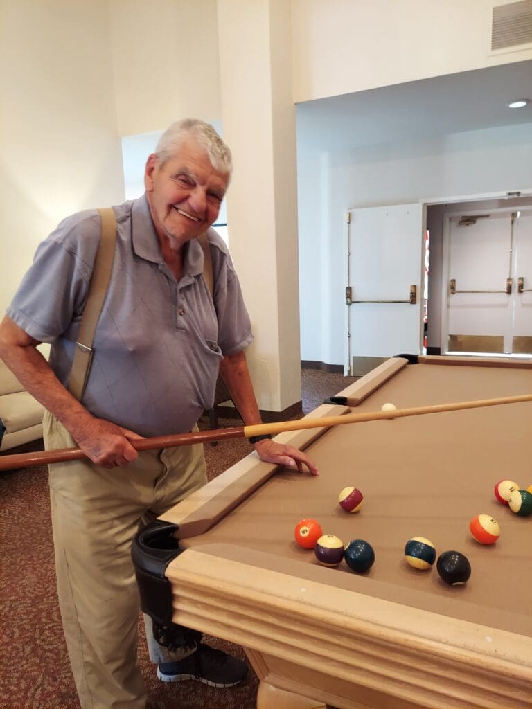 Resident playing billiards El Cajon